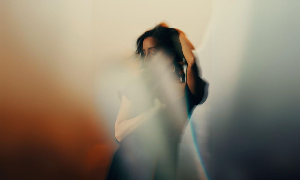 Image of Julianna Rubio Slager with light reflecting and covering her face.