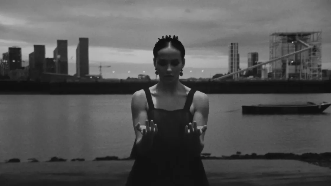 Ballerina looking down at both of her hands