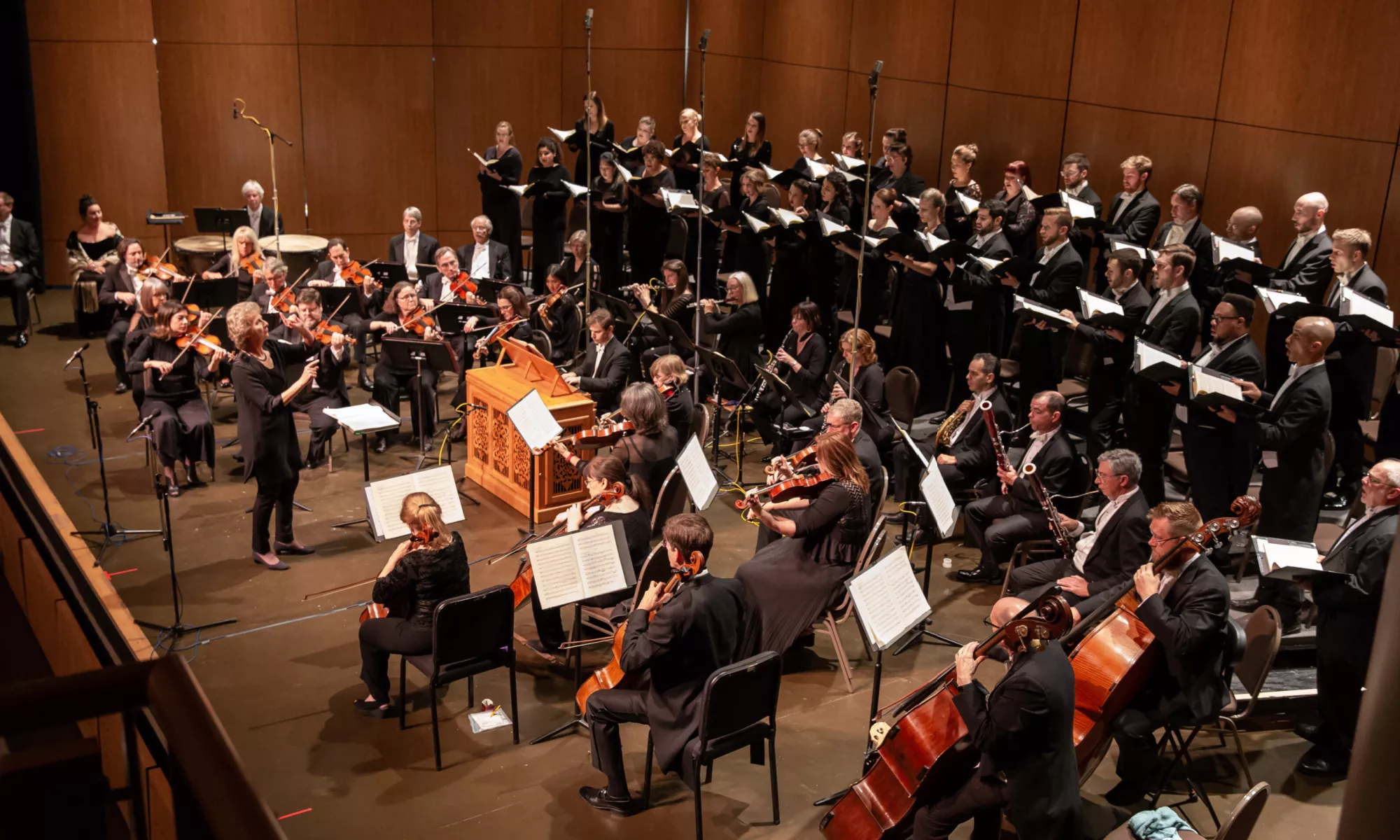 Dame Jane Glover with Music of the Baroque's chorus and orchestra