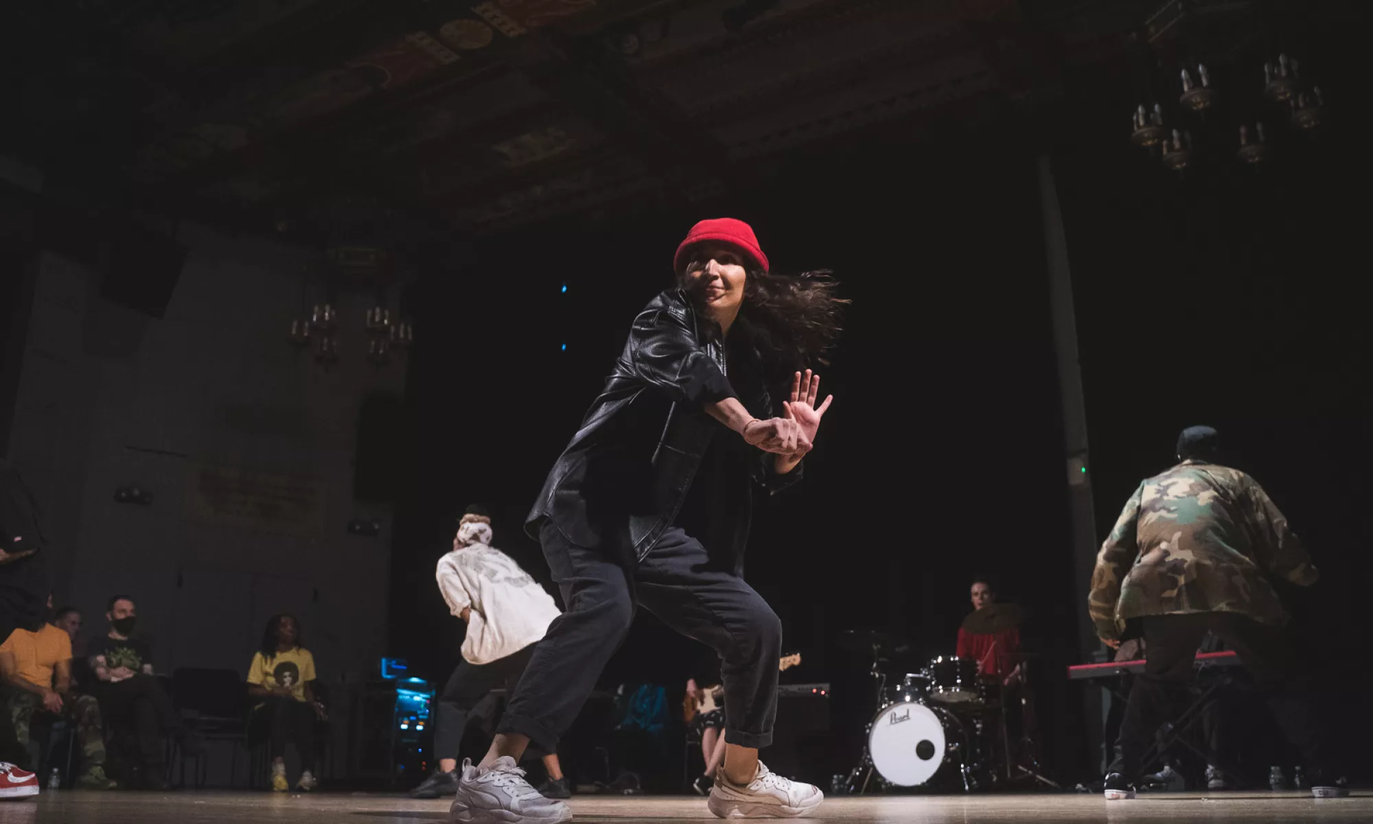 A dancer on stage performing. 