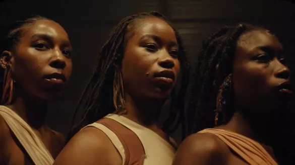 Three African American female dancers facing the same direction