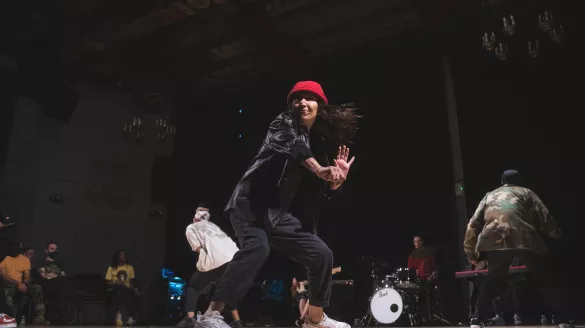 A dancer on stage performing. 