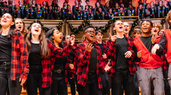 Voice of Chicago emoting while singing wearing black and red checkered flannel shirts. 